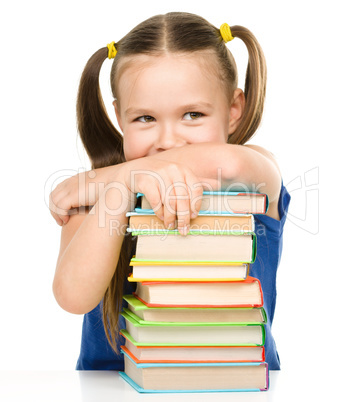 Little girl is showing her books