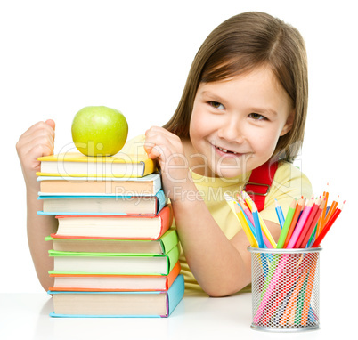 Little girl with her books