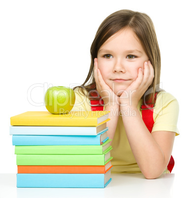 Little girl with her books