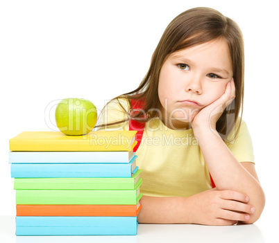 Little girl with her books