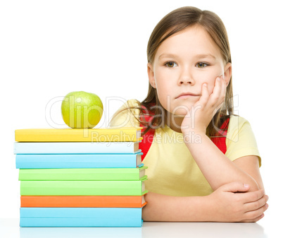 Little girl with her books