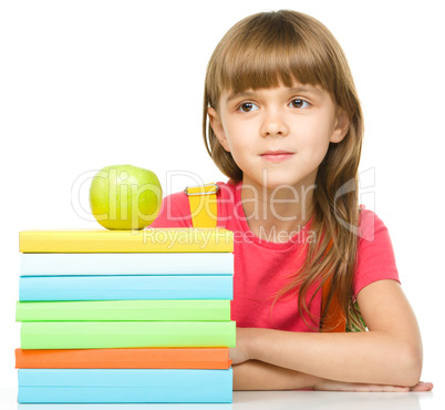 Little girl with her books