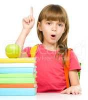 Little girl with her books