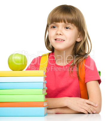 Little girl with her books