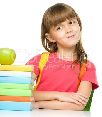 Little girl with her books