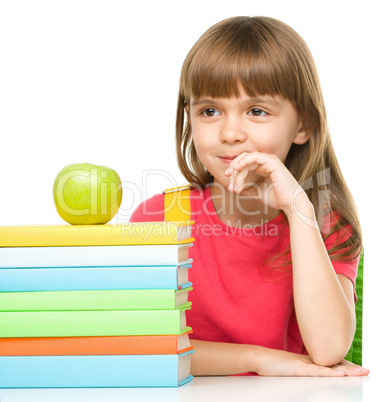 Little girl with her books