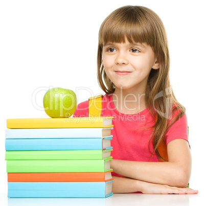 Little girl with her books