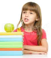 Little girl with her books