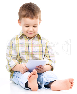 Young boy is using tablet Young boy is using tablet