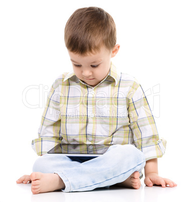 Young boy is using tablet