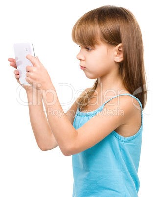 Young girl is using tablet