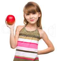 Little girl with red apple