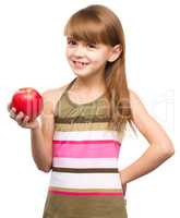 Little girl with red apple