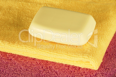 Soap bar on colorful towels