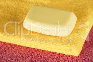 Soap bar on colorful towels