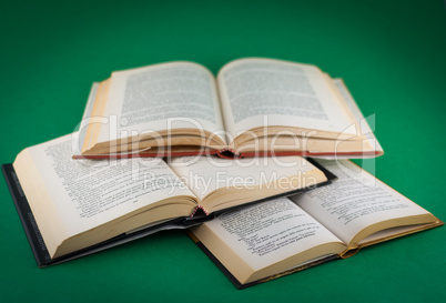 closeup of open books on colored background