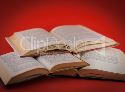 closeup of open books on colored background