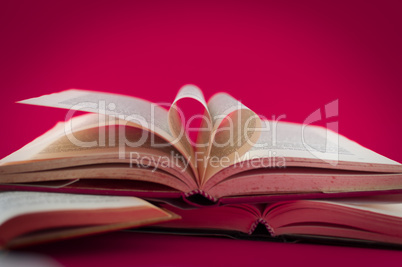 closeup of open books on colored background