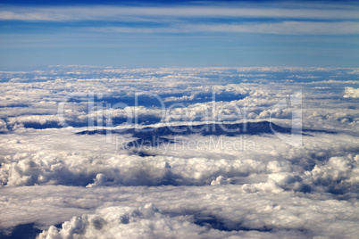 Top view on clouds and mountains