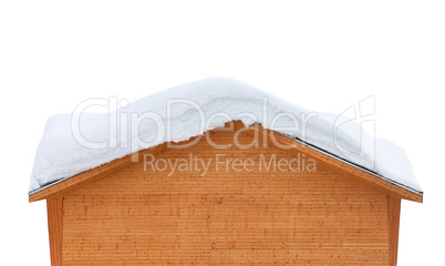 Wooden house with snow on roof
