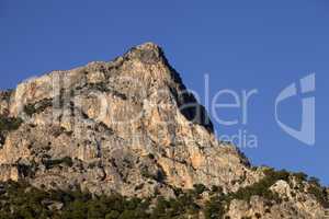 Sunlight rock and blue clear sky