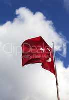 Turkish flag and blue sky with clouds