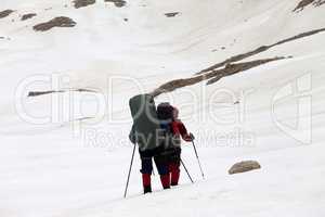 Two hikers on snowy plateau