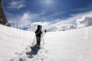 Two hikers on snow plateau