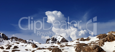 Panoramic view on snowy rocks at nice day