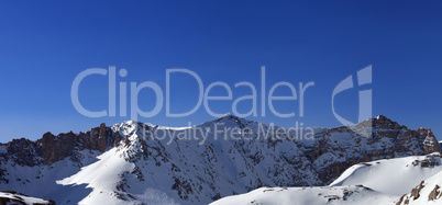 Panoramic view on snowy mountains in morning