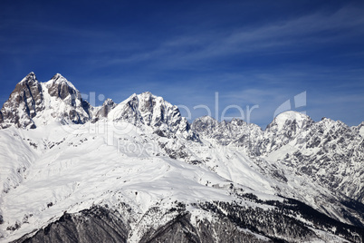 Mount Ushba in winter at wind sunny day