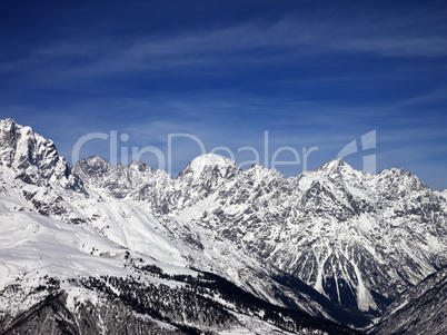 Snowy mountains in wind sunny day