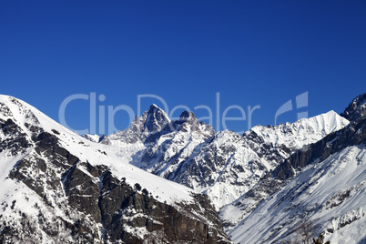 Mountain peaks in winter at sunny day