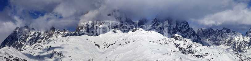 Panoramic view on Mounts Ushba and Chatyn in haze at sunny day