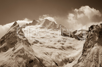 Glacier in winter mountains.