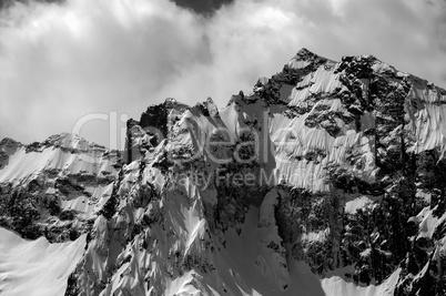 Black and white winter mountains in cloud