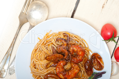 Italian seafood spaghetti pasta on red tomato sauce