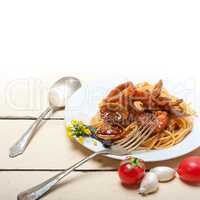 Italian seafood spaghetti pasta on red tomato sauce