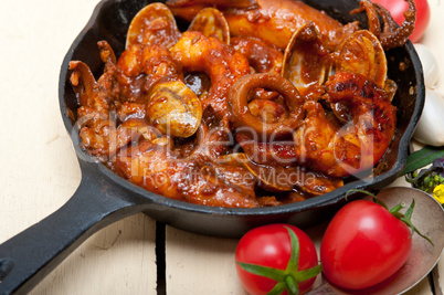 fresh seafoos stew on an iron skillet