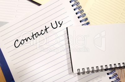 Contact us write on notebook