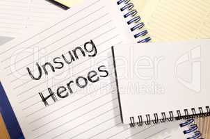 Unsung heroes write on notebook