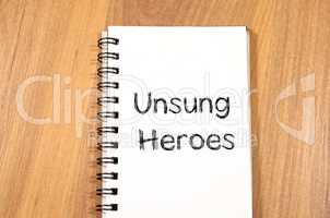 Unsung heroes write on notebook