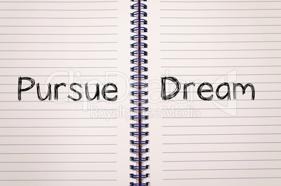 Pursue dream write on notebook