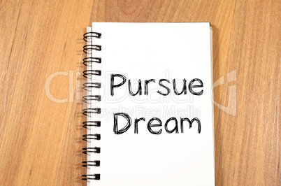 Pursue dream write on notebook