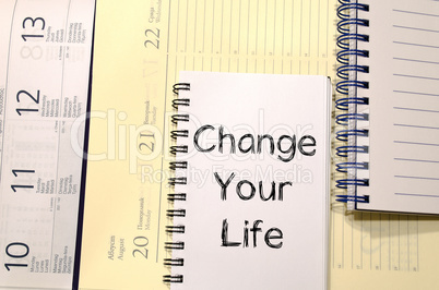 Change your life write on notebook