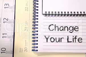 Change your life write on notebook