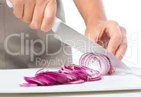 Cook is chopping onion