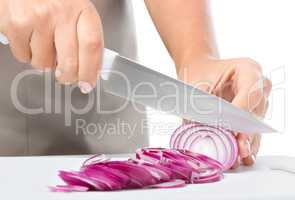 Cook is chopping onion