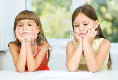 Portrait of two sad little girls