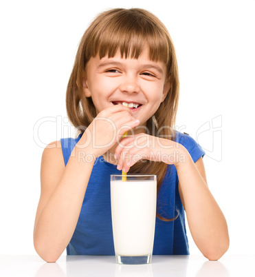 Cute little girl with a glass of milk